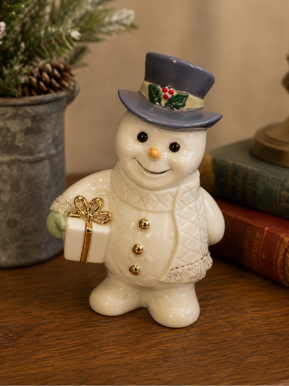 Lenox porcelain snowman figurine holding a gift box Ivory Snowman Collection